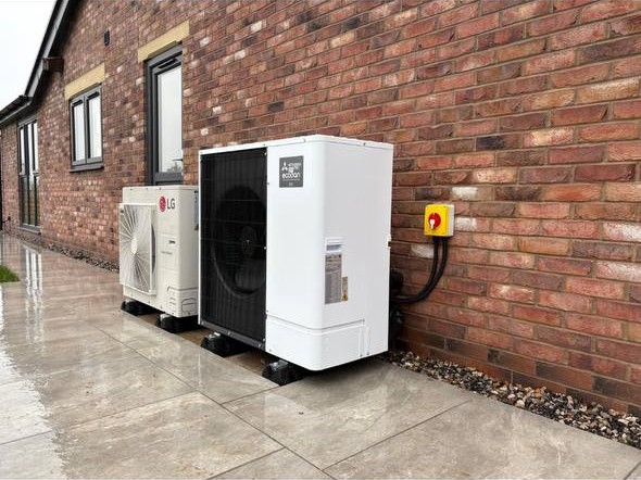 Outdoor air source heat pump unit installed by Ecoheat at a residential property